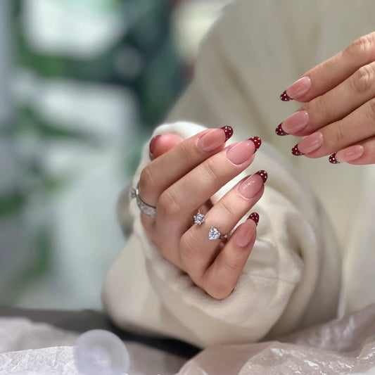 Close-up of the cute polka dot details on the French tip nails.