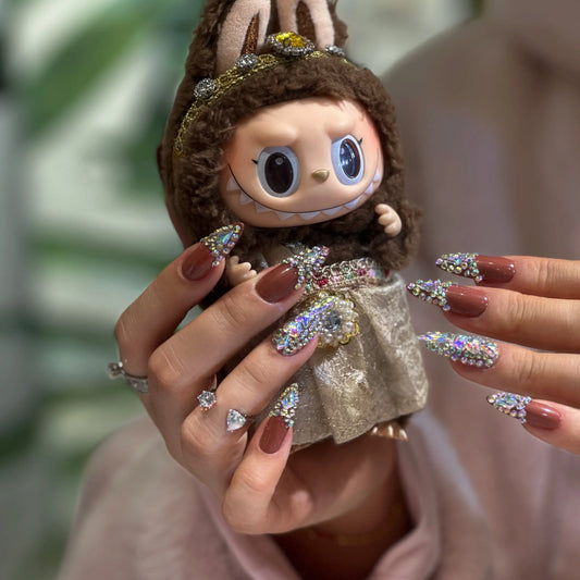 Close-up of the prismatic AB crystal details sparkling on the nails.