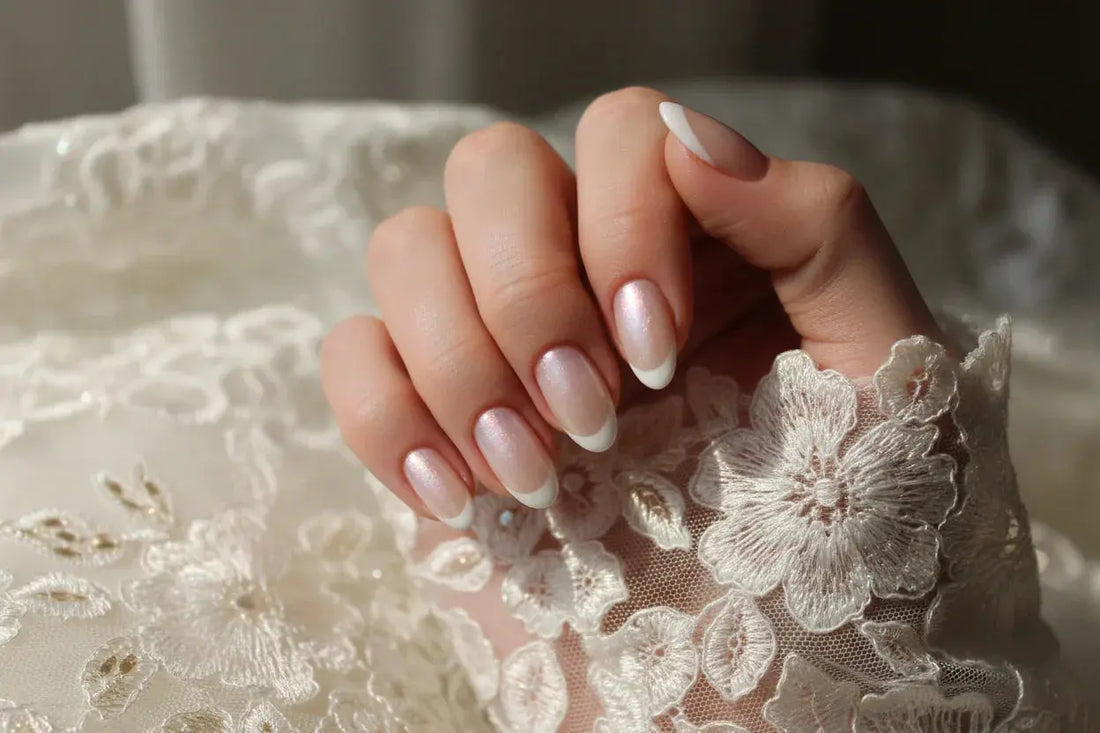 Close-up of a woman's hand with pearl French tip press on nails and lace, Tsuki Nails
