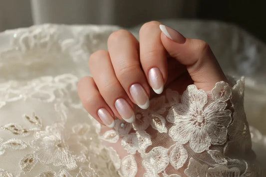 Close-up of a woman's hand with pearl French tip press on nails and lace, Tsuki Nails