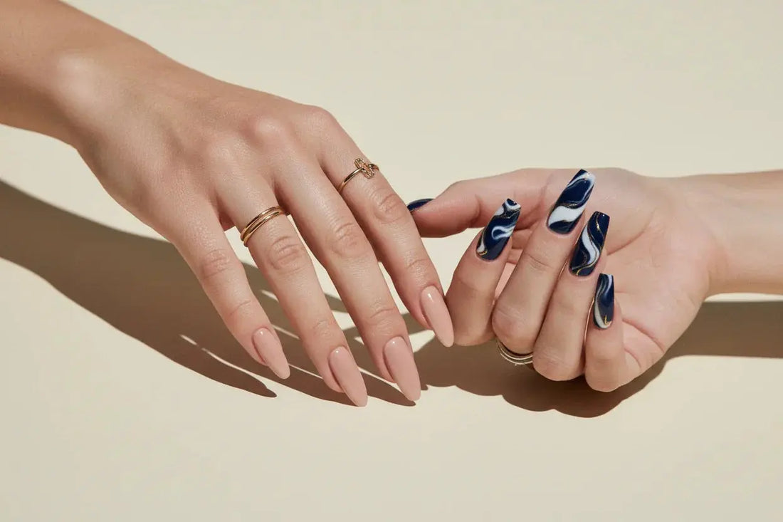 Two hands with Tsuki Nails press on nails: one with nude almond nails, one with blue marble square nails.