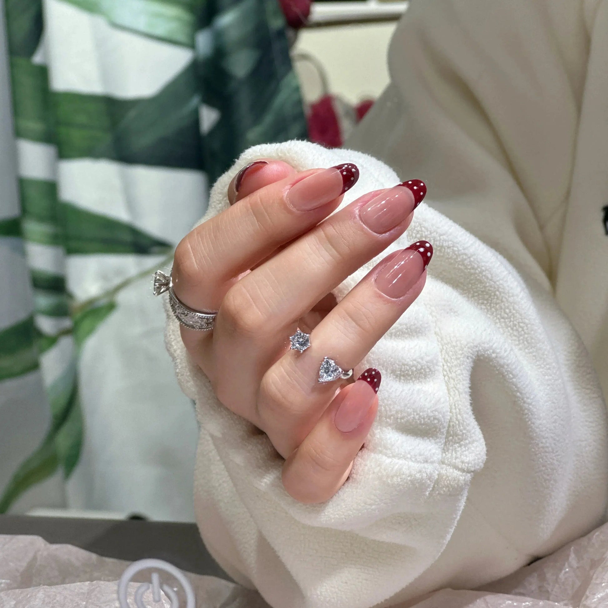 Crisp white French tip on the playful polka dot press on nails.

