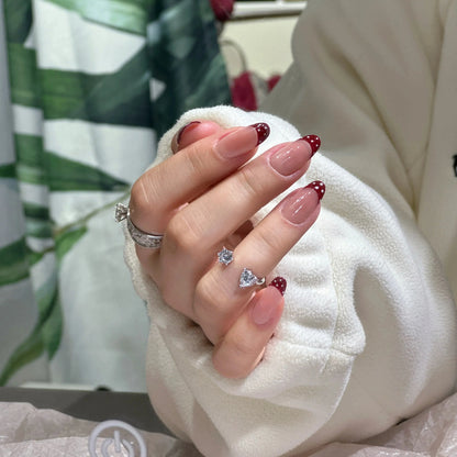 Crisp white French tip on the playful polka dot press on nails.


