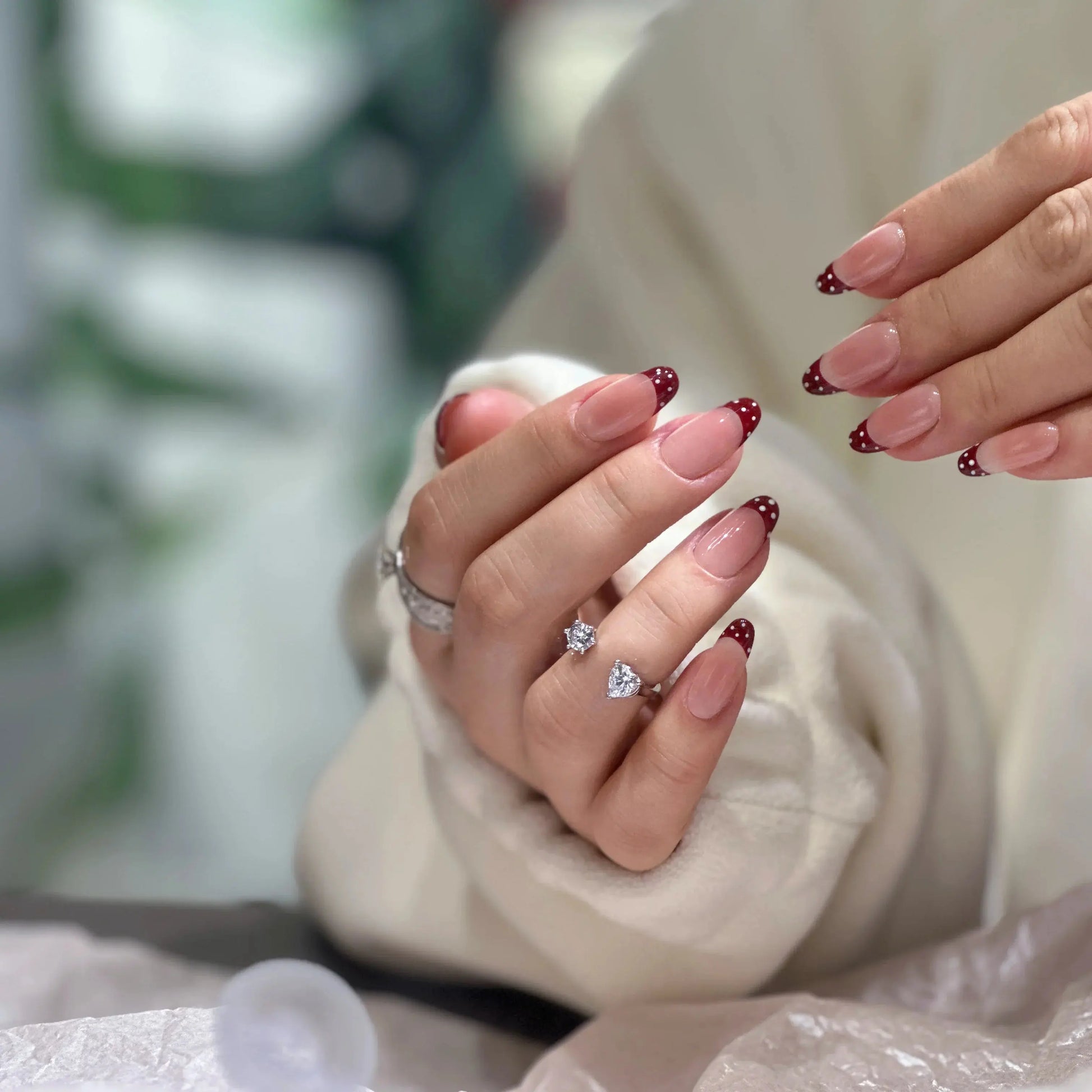 Close-up of the cute polka dot details on the French tip nails.

