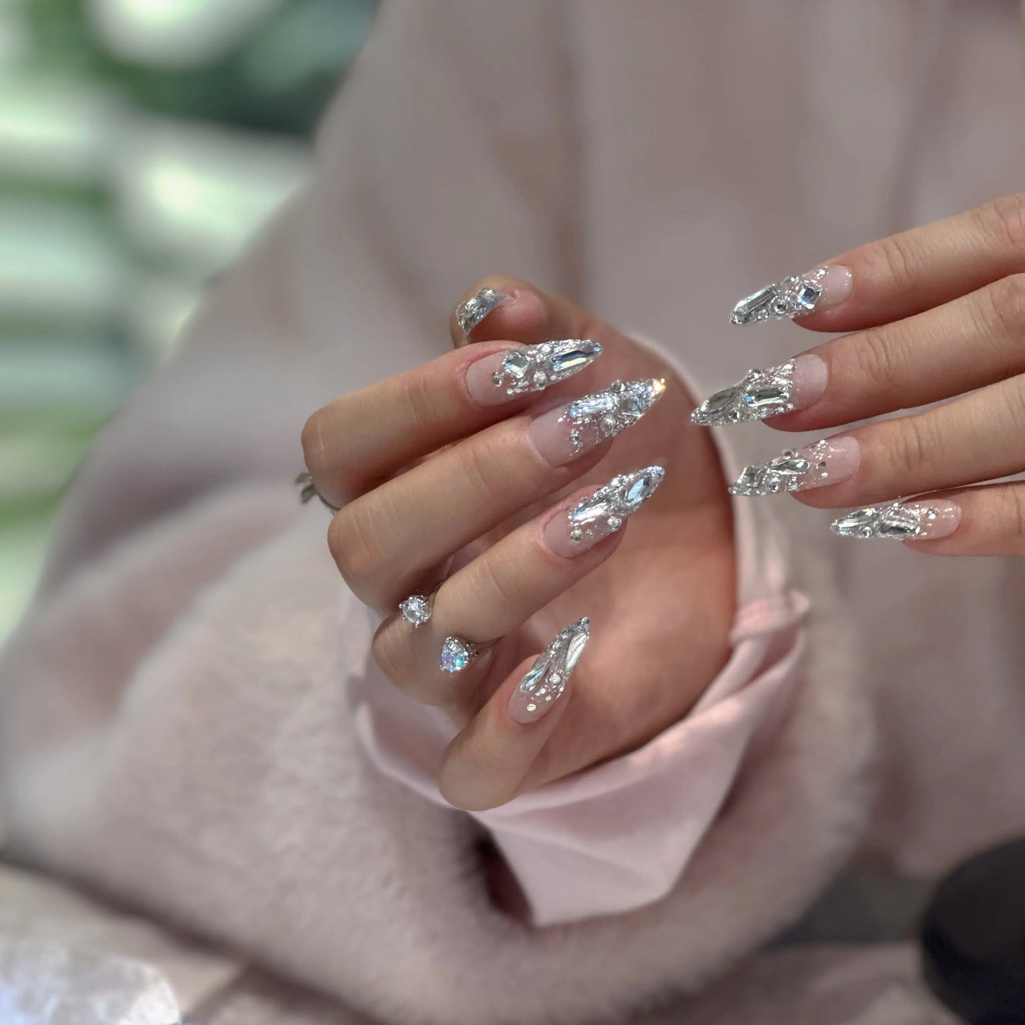 Icy, frosty finish detail on the translucent nude press on nails.

