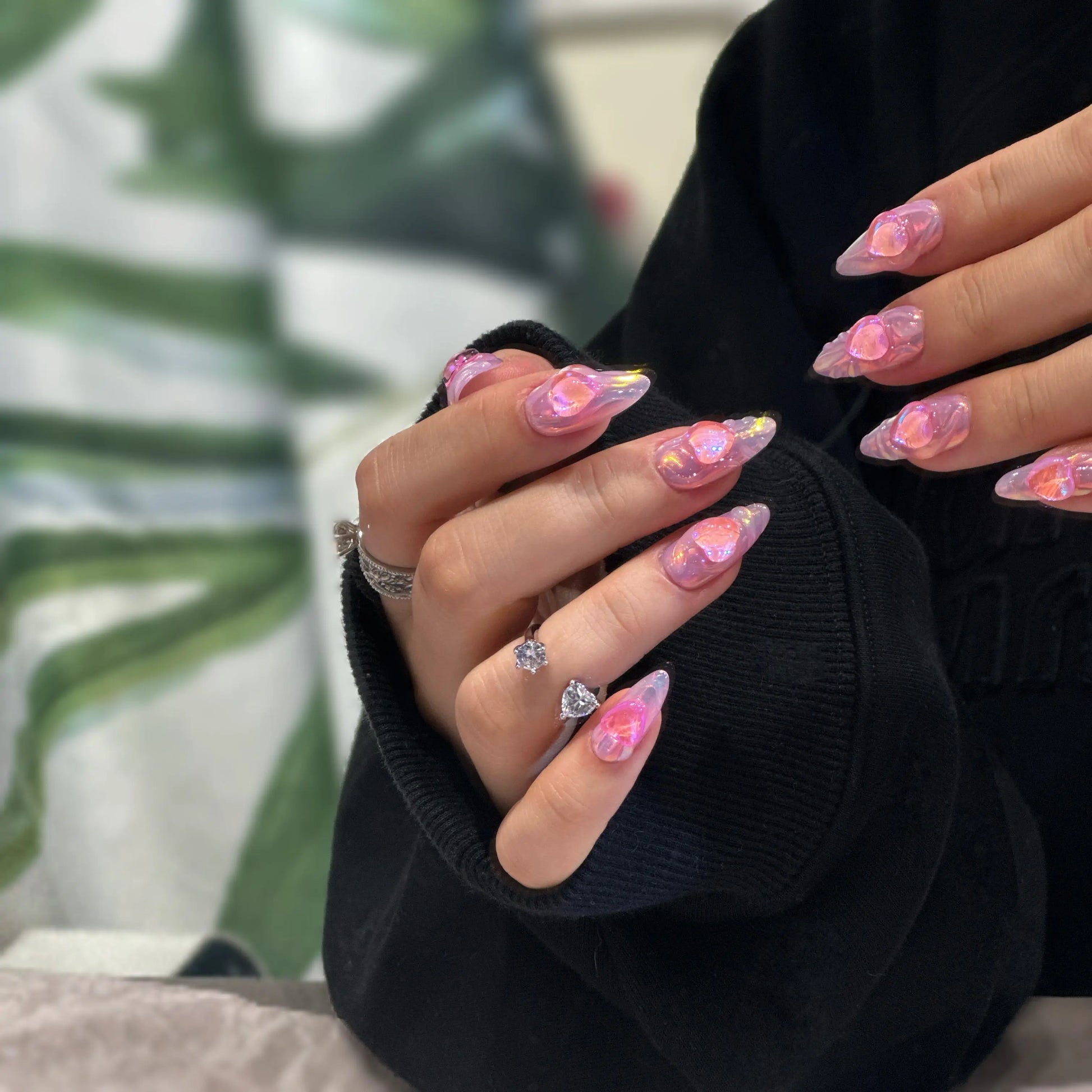 Side view showing the smooth pink ombre color transition on the nails.


