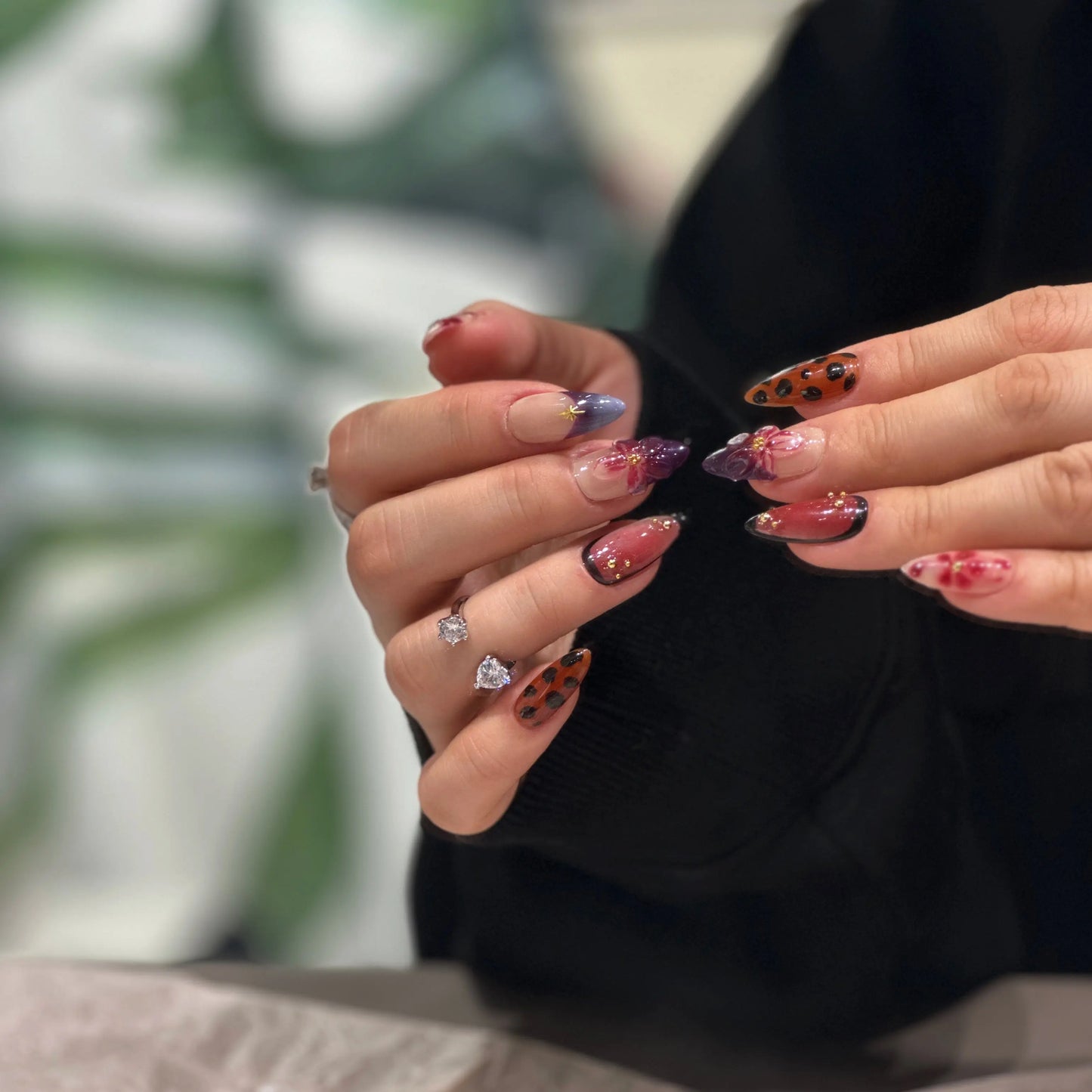 Hand-sculpted floral artwork detail on the Dark Bloom press on nails.