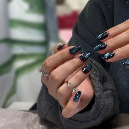 Scattered star details on the celestial-themed press on nails.

