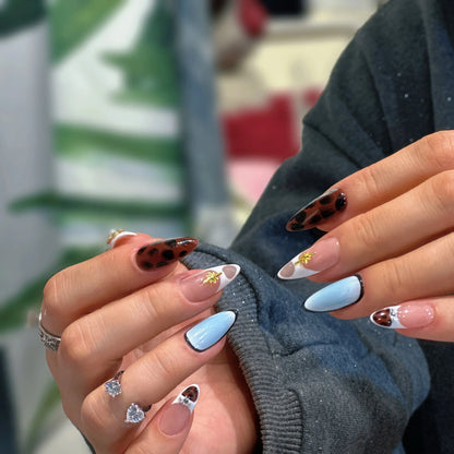 Close-up of the sacred geometric patterns on the press on nails.

