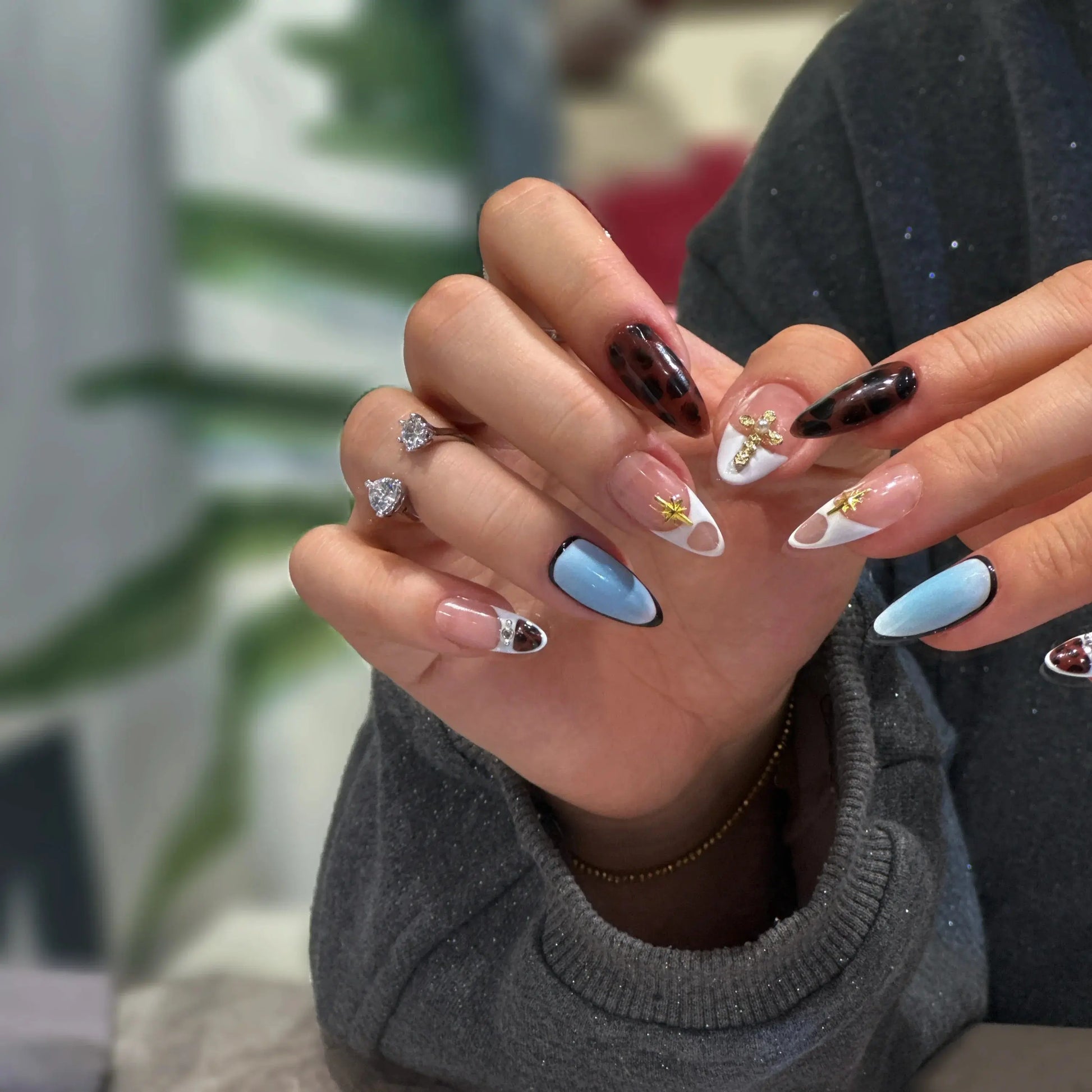 Animal print texture detail on the Faith & Fur nail design.

