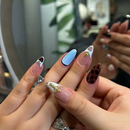 Fearless and unique manicure with Faith & Fur geometric animal print press on nails.

