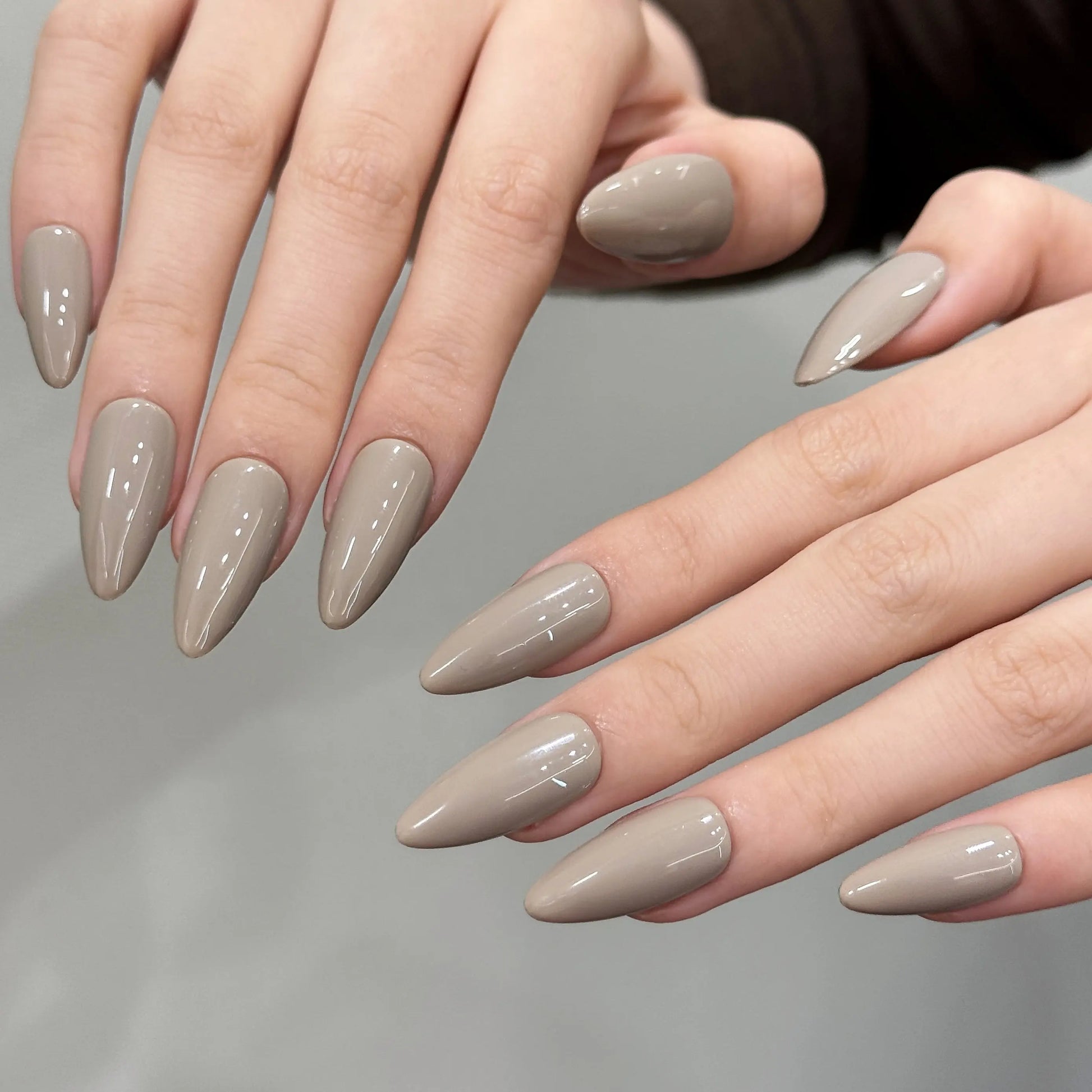 Close-up of the matte finish on the taupe stiletto press on nails.

