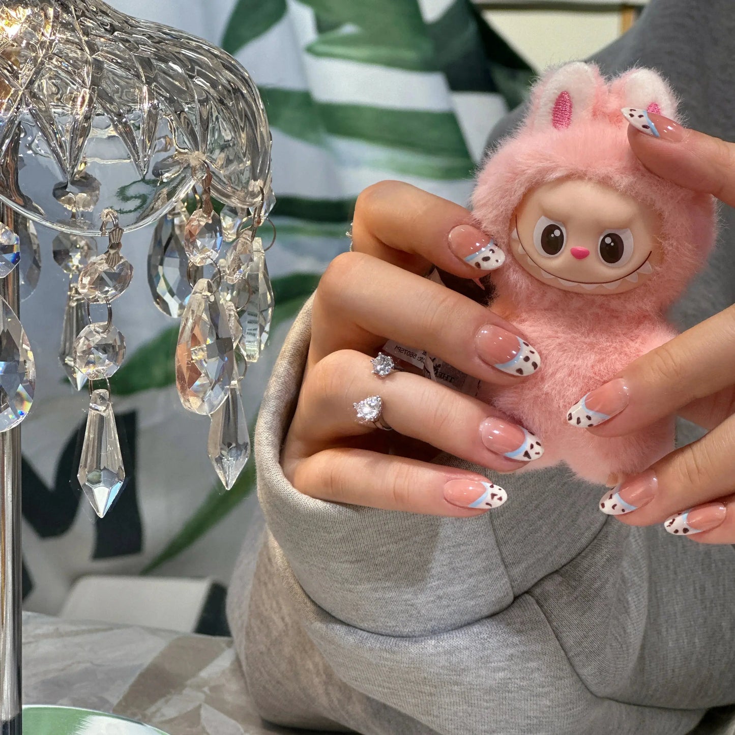 Close-up of the chocolate crumb texture on the French tip nails.


