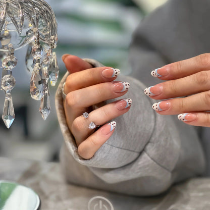 Delicious chocolate French tip design on the nude press on nails.

