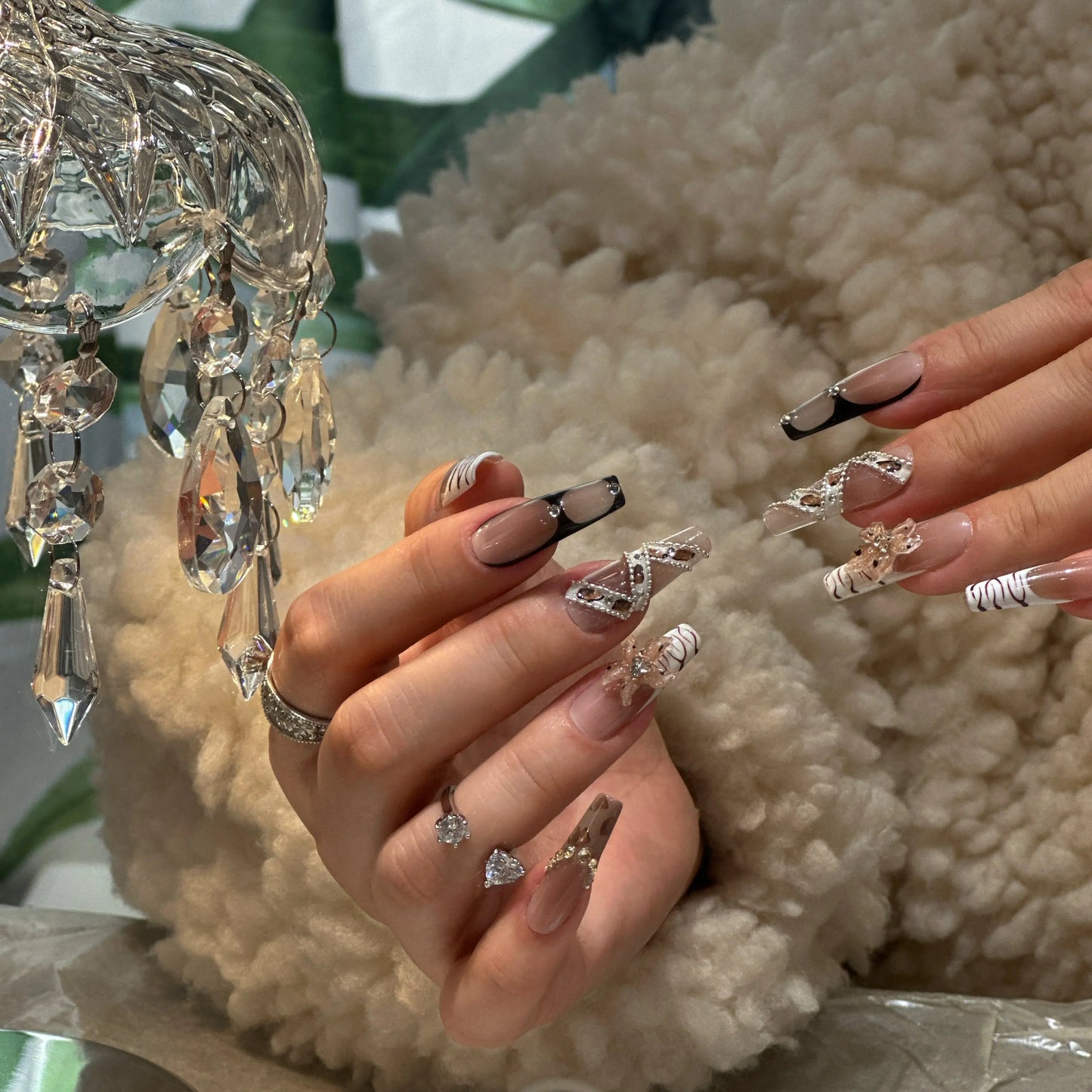 Close-up of the authentic bronze and gold leopard spots on the nails.

