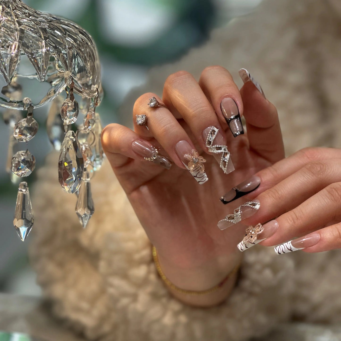 Warm mocha-nude base color and glossy finish on the sophisticated leopard nails.

