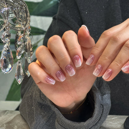 Sparkling glitter finish detail on the ombre press on nails.

