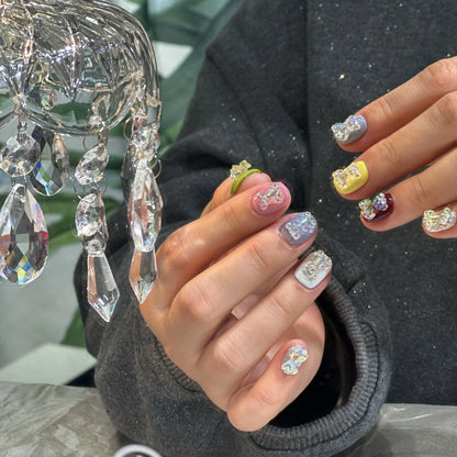 Shimmering glitter finish detail on the multi-color press on nails.

