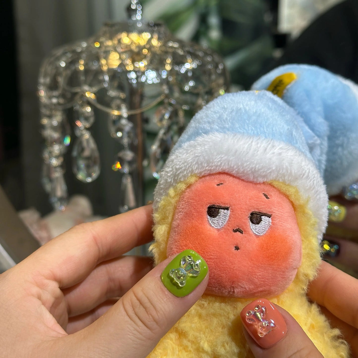 Close-up of the vibrant yellow and deep wine colored glitter nails.

