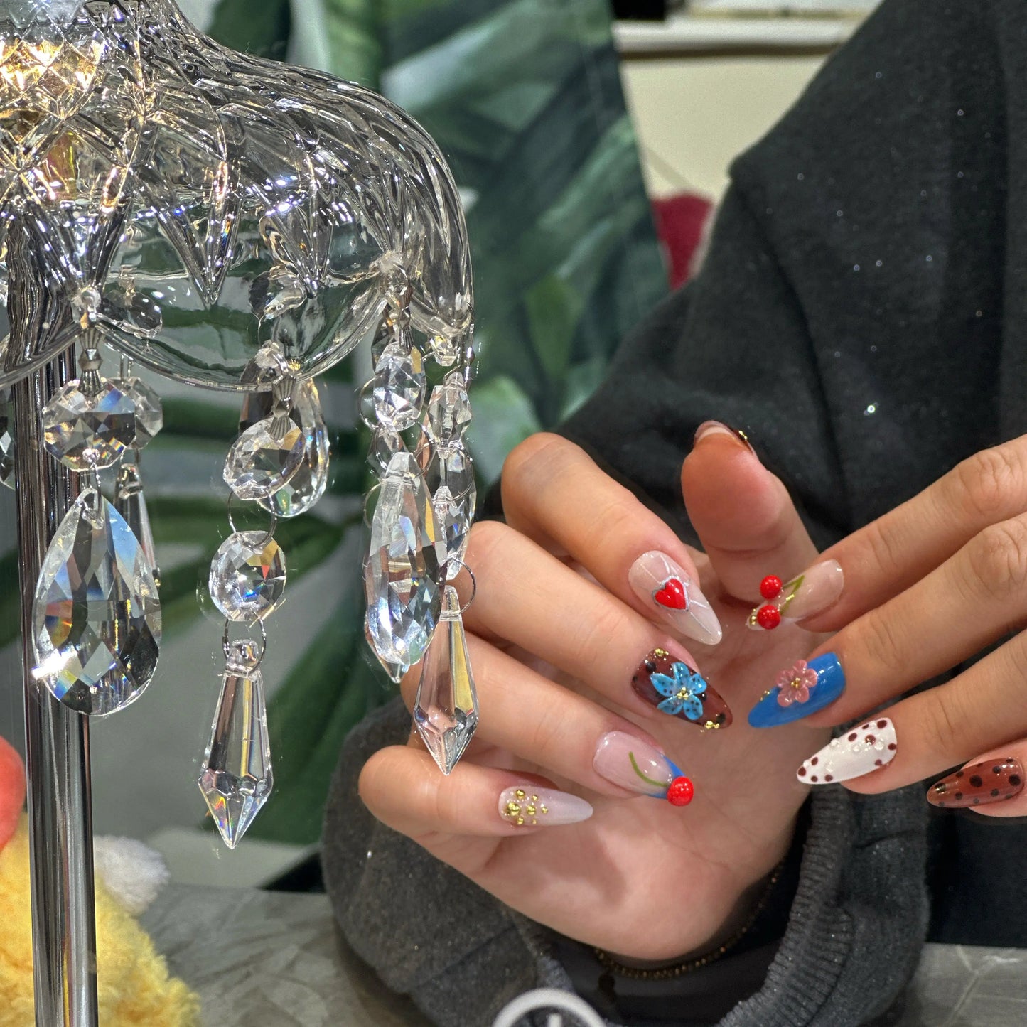 Deep crimson French tips on a soft blush-pink base, glowing effect.

