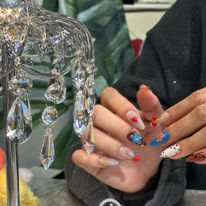 Deep crimson French tips on a soft blush-pink base, glowing effect.

