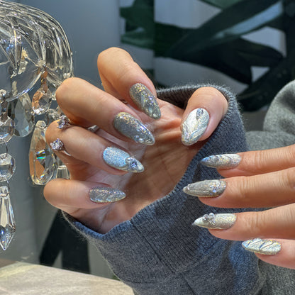 Both hands wearing Silver Feather nails showing complete angelic design with silver glitter and feather patterns
