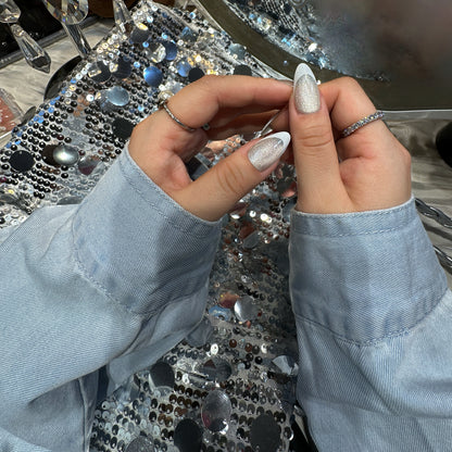 Close-up of Pearl French Shimmer nails showing full-coverage silver shimmer with white French tip and glossy finish
